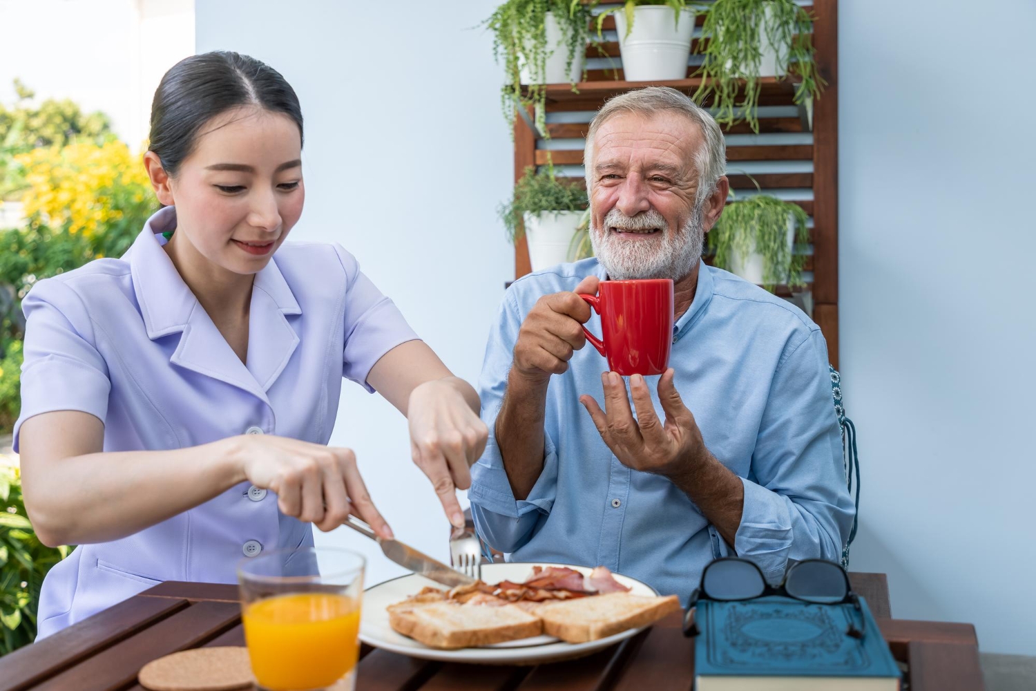 Attendant caregiver supporting an adult client at home