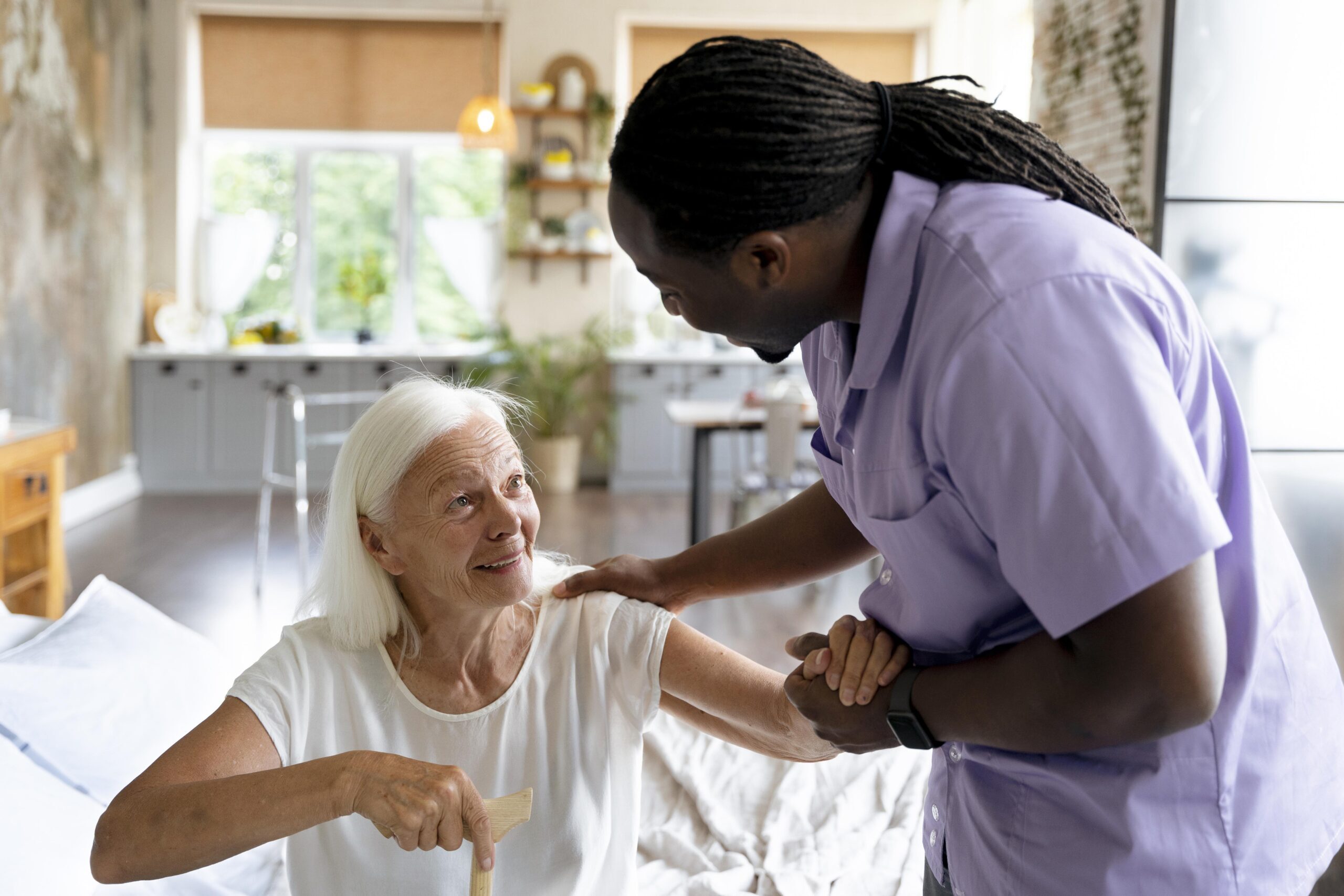 Caregiver assisting a senior with personal care at home
